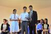 Principal Wong presents the graduation certificates to our graduates representatives: 3A Ng Sin Hoi and 3B Li Yin Ying.