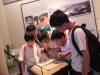 The boys are attracted by the display in Shenzhen Museum.