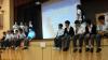 Students are taking on different roles to represent different parties in a mini-forum. 
