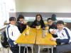 Ms. Ho and 1B students are having snacks together.