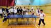 The students are having a table-tennis match.