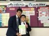Tam Pak Yiu from class 2A was awarded the Second Position in S.2 by the Principal.