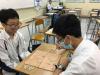 Students are playing Chinese Chess against each other.