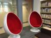 The fiberglass oval shape egg pod chairs at the leisure reading area are perfect for relaxing and reading a good book