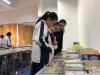 Students are attracted by the covers of the books.