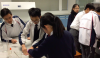 Student helpers were supervising the participants to perform the DNA extraction experiment.