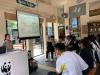 Students are listening attentively to the instructor explaining the biodiversity in Mai Po. 