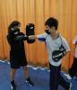 Our student is trying Thai boxing with his fist.