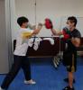 Our student is trying Thai boxing.