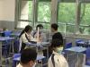 Teacher showed care and talked to students about how to face the coming examination. 