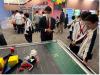 Principal Wong shows students how to control a robot in dynamic and unstructured environments.