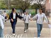Students are experiencing the way the people with visual impairment to walk across the road.