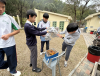 The students masterfully navigate the art of camp stove cooking, with varying degrees of confidence and culinary flair.