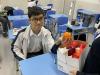 A Student Union committee member distributes fruit to each class.