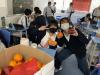 Students enjoy the fruit after lunch.