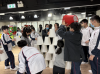 Teamwork in action! Students collaborate to build an impressive tower of buckets, showcasing creativity and cooperation in a fun challenge.