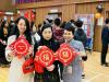 Teacher and student wear traditional Chinese costumes to celebrate the arrival of the Lunar New Year.