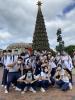 TNK juniors were shining in front of Giant Christmas Tree in Disneyland.